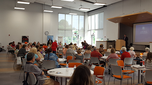 Audience Listening To Attorney Generals Office